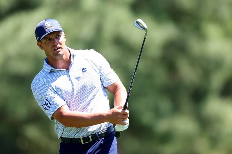 Bryson DeChambeau chips on to the eighth green during the second round of the 2024 Masters where he is in a challenging position on the leaderboard. Photograph: Andrew Redington/Getty Images