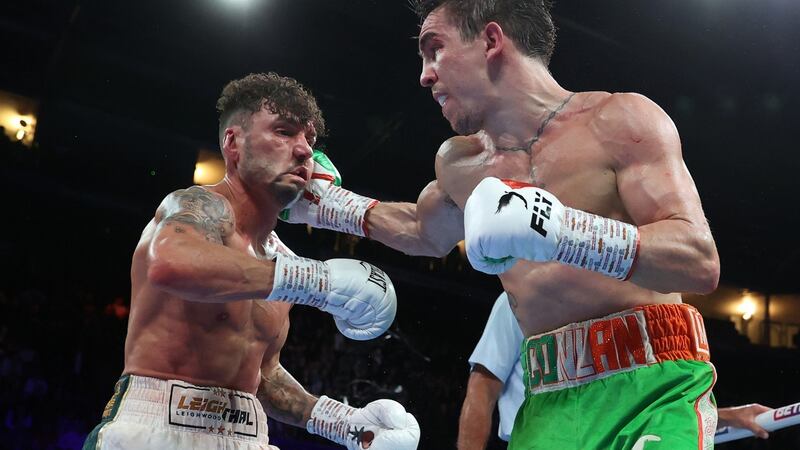 Michael Conlan lands a right against Leigh Wood during their WBA World Featherweight title fight at the Motorpoint Arena in Nottingham. Photograph: Mark Robinson/Inpho/Matchroom Boxing