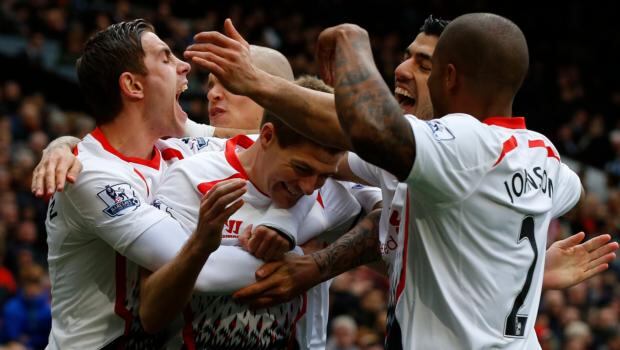 Liverpool’s Steven Gerrard (centre) celebrates scoring his second penalty against Manchester United. Photograph: Phil Noble/Reuters