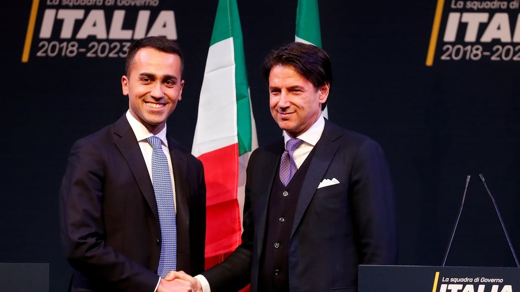5-Star Movement leader Di Maio shakes hands with Giuseppe Conte in Rome in March. Conte, a little-known law professor, has been put forward as prime minister to lead the coalition. Photograph: Remo Casilli/Reuters