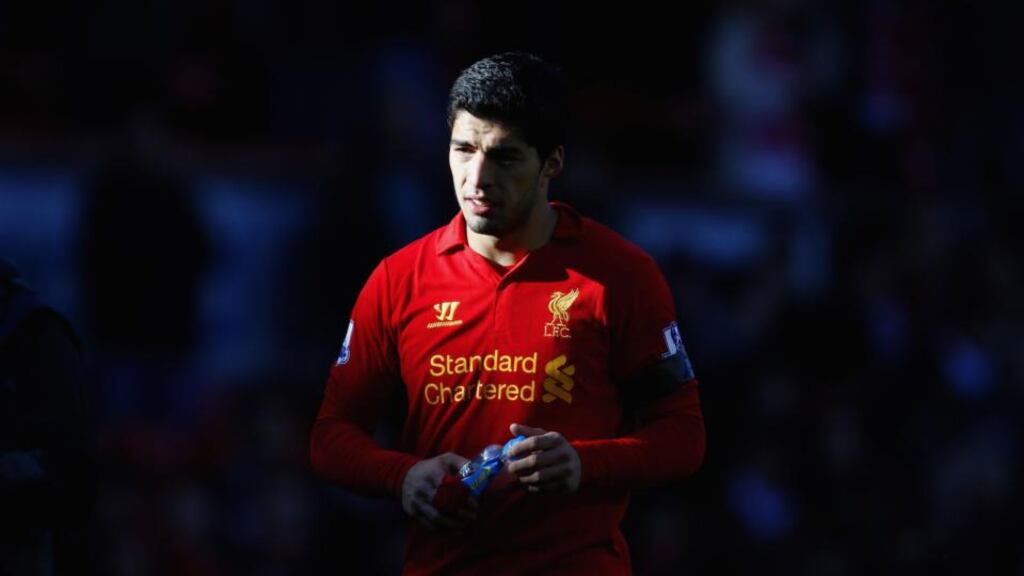 Liverpool's Luis Suarez after he appeared to bite Chelsea's Branislav Ivanovic during the Premier League match at Anfield yesterday. Photograph: Peter Byrne/PA