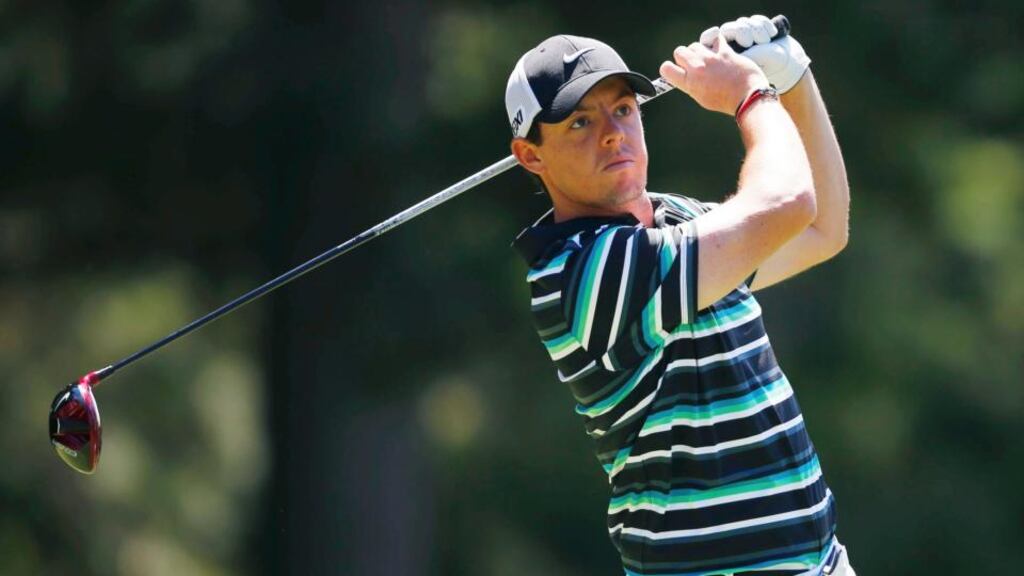 Rory McIlroy plays his tee shot on the fourth hole at Oak Hill. Photograph: Jeff Haynes/Reuters