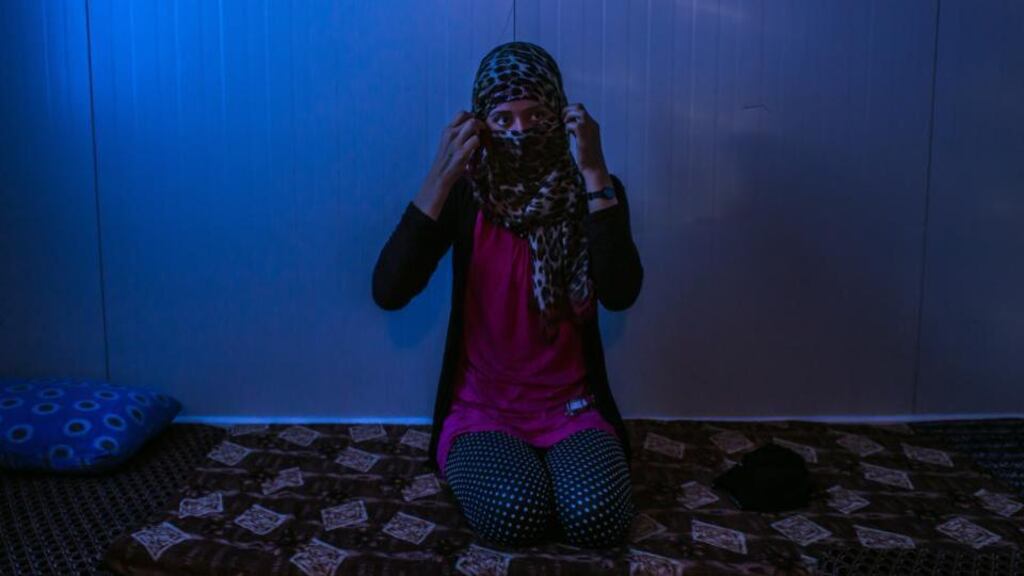 A 19-year-old Yazidi woman, one of hundreds who says she was taken into sexual slavery by the Islamic State group, now living at a refugee camp in Qadiya, Iraq. Photograph: Mauricio Lima/The New York Times