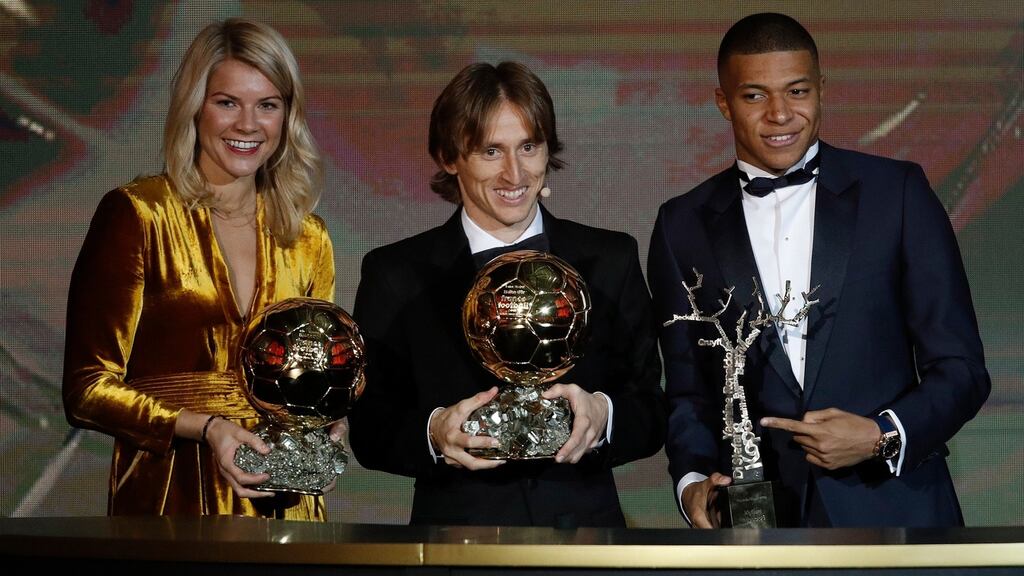 Ada Hegerberg, Luka Modric and Kylian Mbappe with their ‘Ballon d’Or’ trophies. Photograph: PA