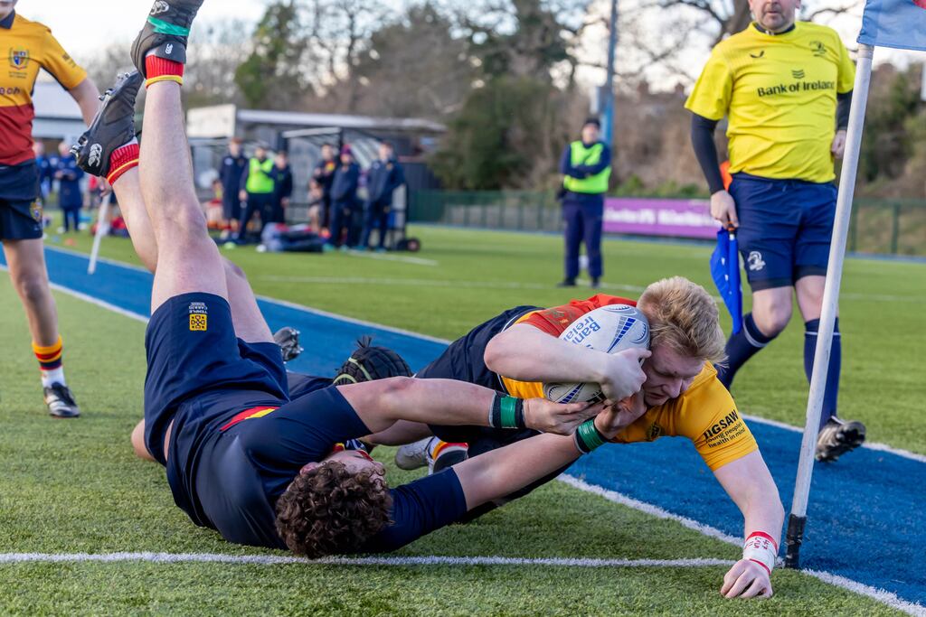 Rory O'Connor-O'Hehir gets past Temple Carrig’s Joshua Burke Emery to score for St Fintan's. Photograph: Morgan Treacy/Inpho