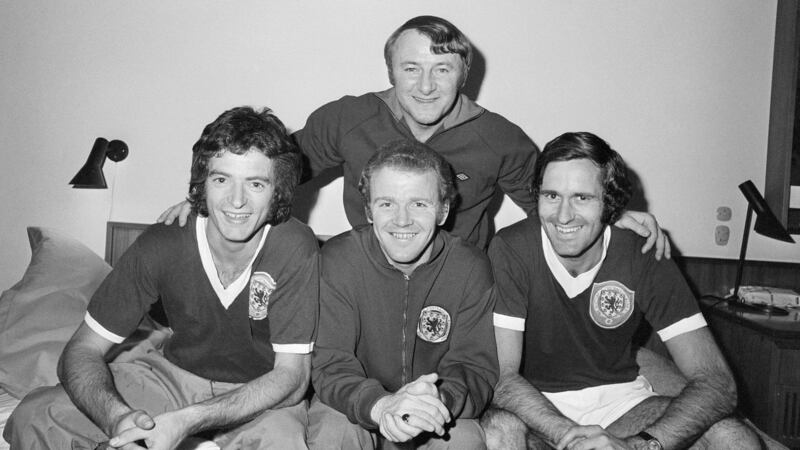 Tommy Docherty with Willie Morgan, Billy Bremner and George Graham ahead of a 1974 World Cup qualifier against Denmark in Copenhagen. Photograph: Monte Fresco/Getty