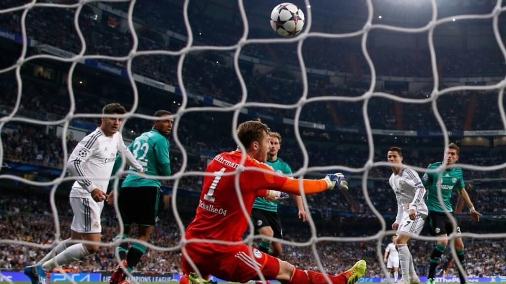 Schalke goalkeeper Ralf Fahrmann saves a header from Real Madrid’s Cristiano Ronaldo. Rivals in this morning’s draw will be hoping defending champions Bayern Munich and La Liga leaders Real Madrid are drawn against each other.