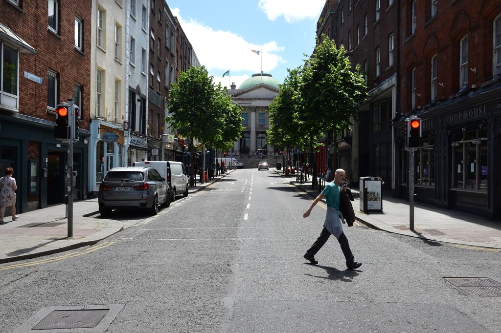 Parliament Street: Dublin City Council last summer trialled a pedestrian and cycle-only zone on Thursday, Friday and Saturday evenings from 6.30pm to 11pm. It is now planning to introduce permanent measures to eliminate or reduce traffic on the city centre street. Photograph: Dara Mac Dónaill