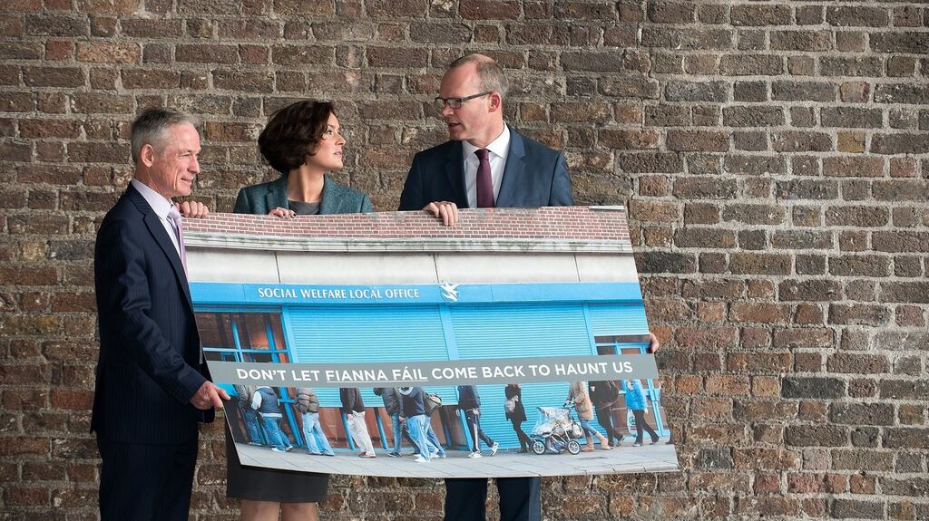 FG’s Richard Bruton and Simon Coveney join candidate Kate O’Connell with their latest poster. photograph: barry cronin