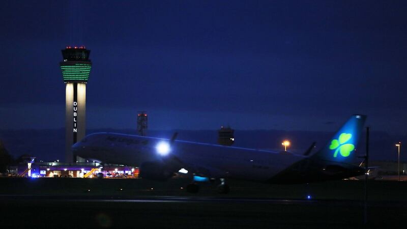 A large beam of light shines out of the new air traffic control tower at Dublin airport as part of the Shine Your Light campaign in tribute to front line health workers and those affected by the coronavirus outbreak. Photograph: Brian Lawless/PA Wire