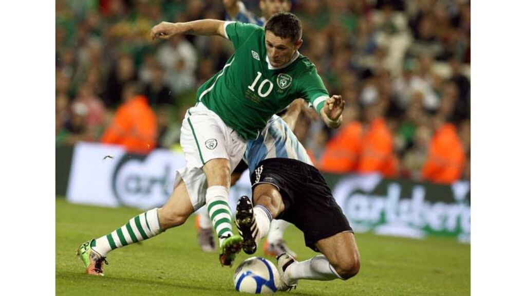 Ireland's Robbie Keane tackled in the box by Martin Demichelis at the end of the friendly international against Argentina at the Aviva Stadium where Keane won his 100th senior cap. (Photograph: Dan Sheridan/Inpho)