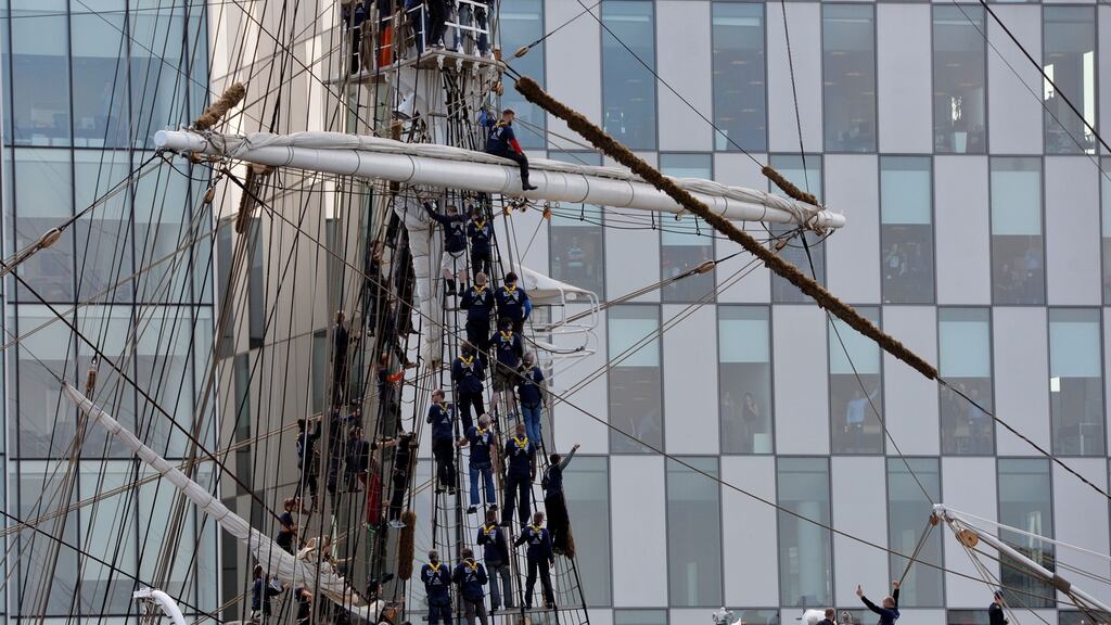 Norwegian tall ship Statsraad Lehmkuhl arriving into Dublin port with members of its crew singing from the rigging - as part of research into how sea shanties make for happier work environments. Photograph: Alan Betson / The Irish Times