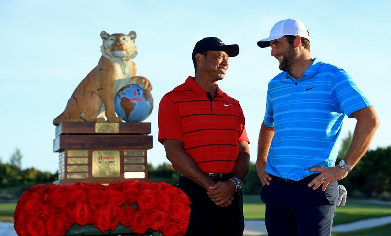 Scottie Scheffler and tournament host Tiger Woods pose with the trophy after Scheffler won the Hero World Challenge at Albany Golf Course in Nassau. Photograph: Mike Ehrmann/Getty Images