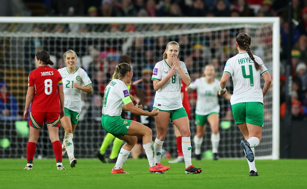 Ireland's Ruesha Littlejohn celebrates with team-mates after Wales goalkeeper Olivia Clark scores an own goal following her long-distance strike, in Cardiff, Wales. Photograph: Michael Steele/Getty Images