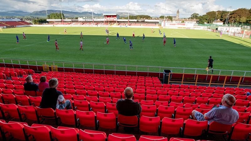A limited number of socially-distanced fans watch Sligo v Waterford last August. Photo: Morgan Treacy/Getty Images