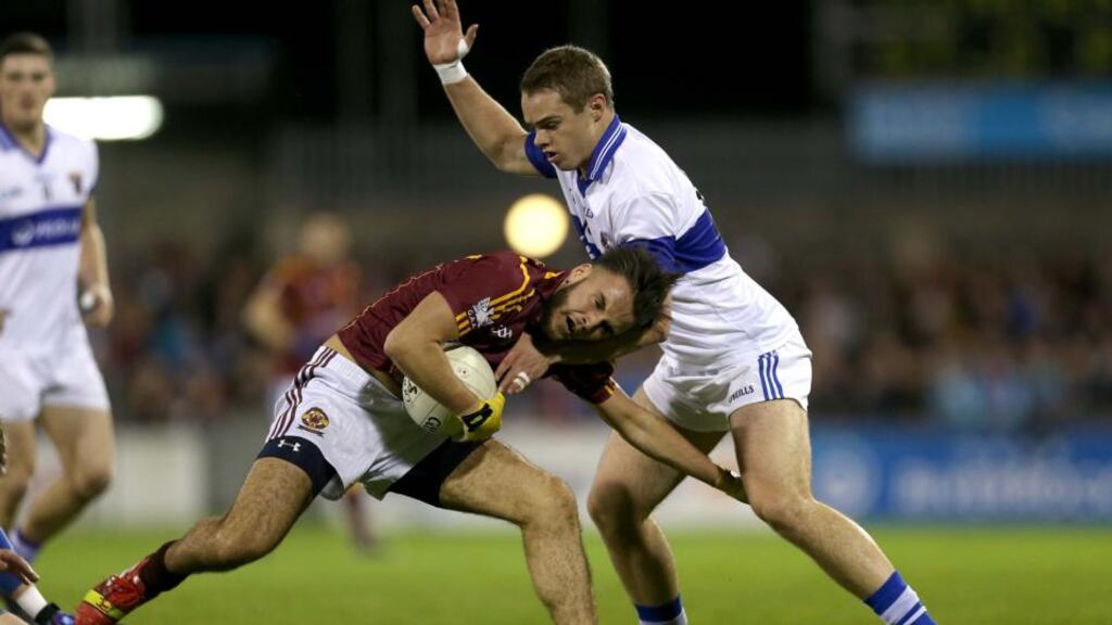 Gavin Burke of St Vincent’s collides with Shane Lyons of St Oliver Plunkett’s during the Dublin Senior football club final at Parnell Park, Dublin, last night. Photograph: Ryan Byrne/Inpho