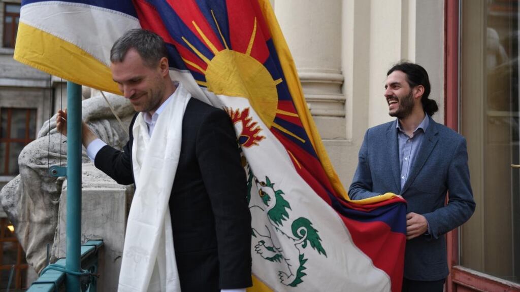 Prague mayor Zdenek Hrib (left) hanging the Tibetan flag on city hall in March 2019. Beijing has cancelled tours by Prague orchestras and scrapped a co-operation deal with Prague due to Hrib’s support for Tibet and Taiwan. Photograph courtesy of Prague city hall