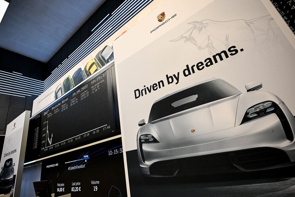 A banner shows the image of a Porsche Taycan during the IPO of German car manufacturer Porsche at the Frankfurt Stock Exchange. Photograph: Sascha Steinbach/EPA