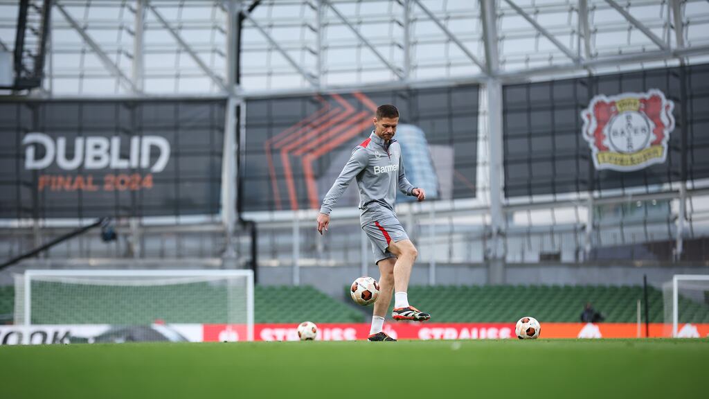 Bayer Leverkusen head coach Xabi Alonso controls the ball during a training session ahead of their Europa League final against Atalanta at the Aviva Stadium. Photograph: Alex Grimm/Getty Images
