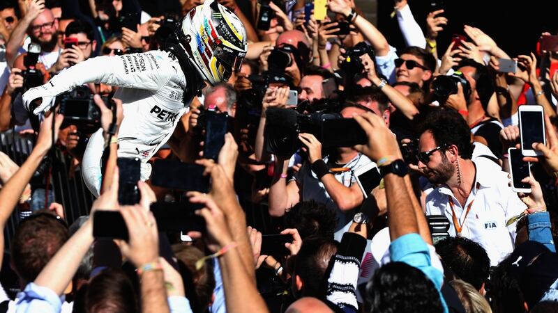 Lewis Hamilton celebrates in Parc Ferme during the United States Formula One Grand Prix. Photograph: Mark Thompson/Getty Images