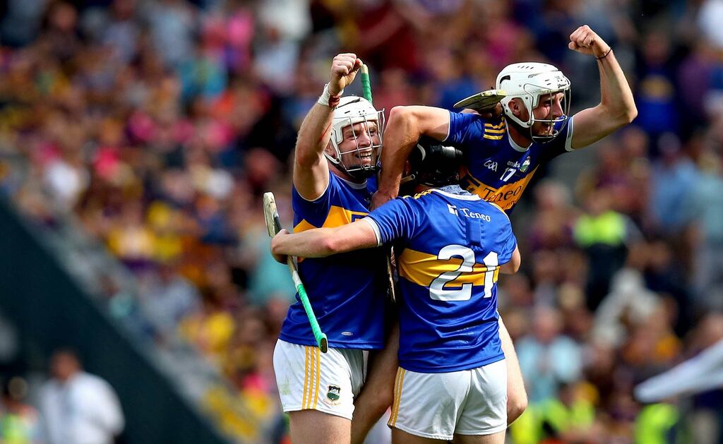 Tipperary’s Padraic Maher, Alan Flynn and Ger Browne celebrate  their  1-28 to 3-20 senior hurling championship semi-final win over Wexford  in Croke Park. Photograph: Ryan Byrne/Inpho
