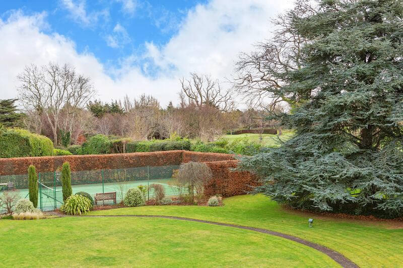At the far end of the south-facing garden is a hard tennis court, moved from Kenny’s original location by a subsequent owner.