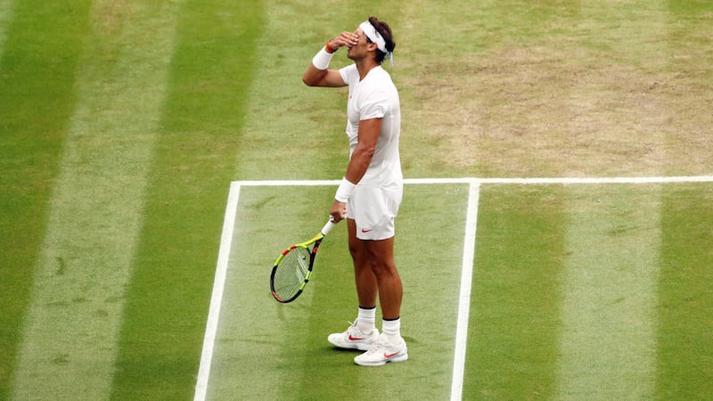 Rafael Nadal reacts during his semi-final defeat to Novak Djokovic at Wimbledon. John Walton/EPA