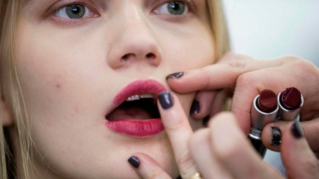 A model has her lipstick applied during New York Fashion Week. Photograph: Keith Bedford/Reuters