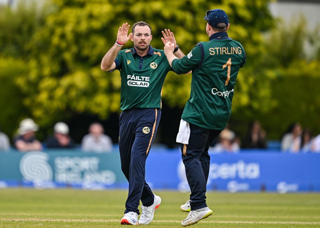Ireland bowler Liam McCarthy (left) celebrates with team-mate Paul Stirling after taking the wicket of West Indies's Keacy Carty. Photograph: Sam Barnes/Sportsfile