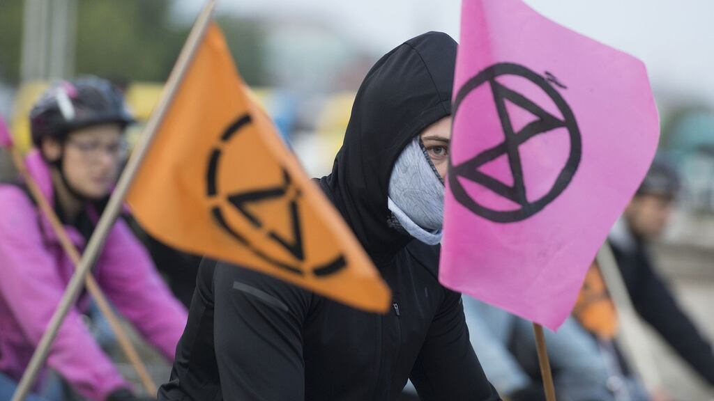 A slow cycle through Dublin city centre was staged in solidarity with Extinction Rebellion’s week of direct action on climate change. Photograph: Dave Meehan