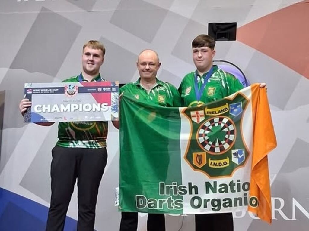 Ireland's Aidan O'Hara (left) and Jack Courtney celebrate winning the WDF World Cup Youth Pairs with their manager Paddy Cullen