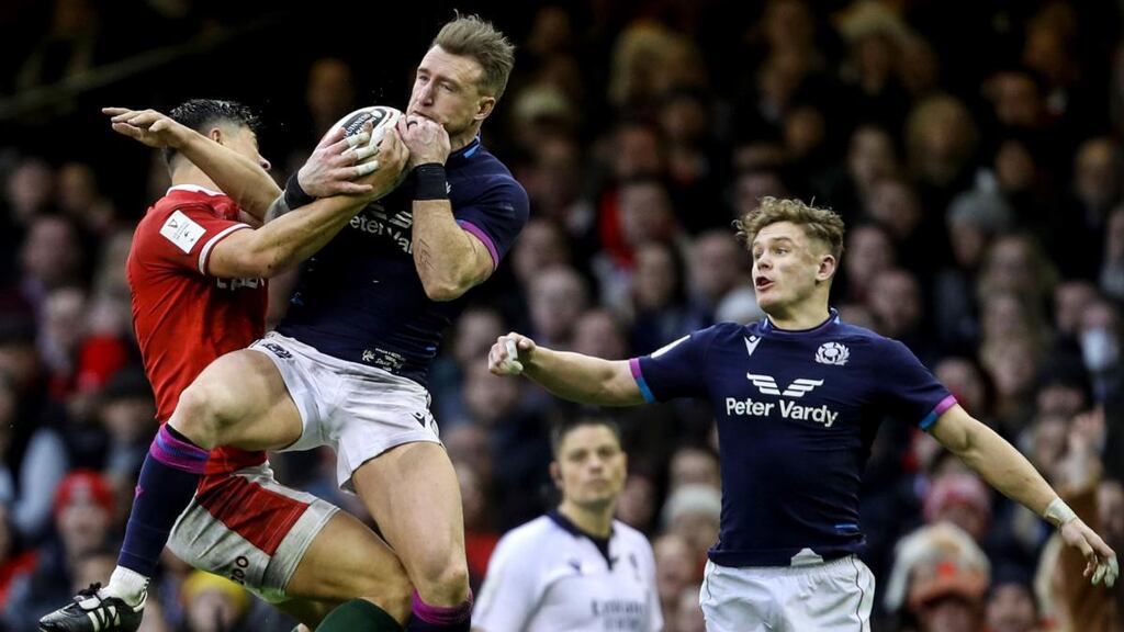 Wales’ Louis Rees-Zammit competes in the air with Stuart Hogg of Scotland during the Six Nations match at the Principality Stadium. Photograph: Laszlo Geczo/Inpho