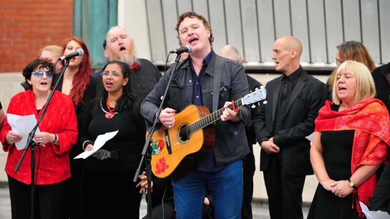 Mundy with the High Hopes Choir performing at a concert in Dublin celebrating 30 years of Focus Ireland. Photograph: Aidan Crawley