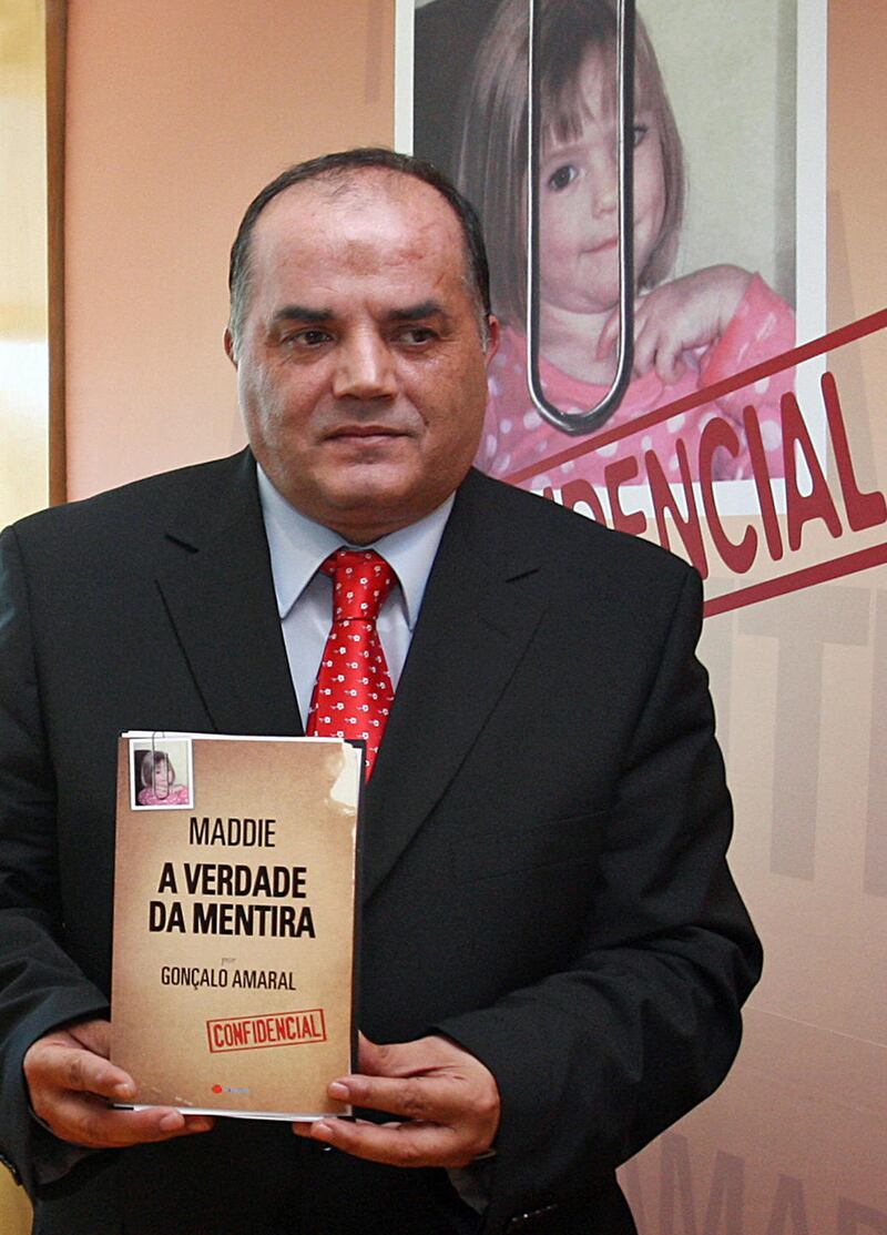 Former Policia Judiciaria (Crime Police) detective Goncalo Amaral holds a copy of his book entitled “Maddie:The Truth about the Lie” regarding the disappearance of British girl Madeleine McCann, as he speaks during its launch in Lisbon on July 24, 2008. Amaral led the investigation on the McCann case until he was removed from the case. Lawyers for parents Kate and Gerry McCann have been poring over the contents of the book, in which accusations of involvement by the parents in their daughter’s disappearance are repeated. AFP PHOTO/ JOAO CORTESAO (Photo credit should read JOAO CORTESAO/AFP/Getty Images)