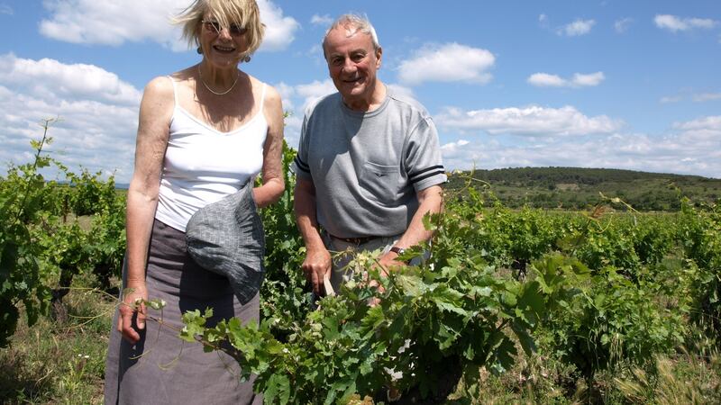 Patrick Masterson with his late wife Frankie, who had unsuccessfully encouraged him to write a novel, in their vineyard near St Chinian
