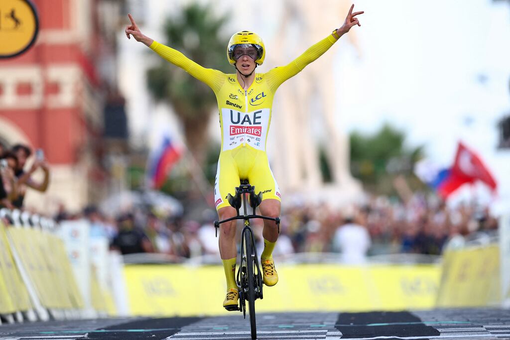 Slovenia's Tadej Pogacar of UAE Team Emirates celebrates as he crosses the line to win the 21st and final stage and the overall victory in the Tour de France. Photograph: Anne-Christine Poujoulat/AFP via Getty Images)