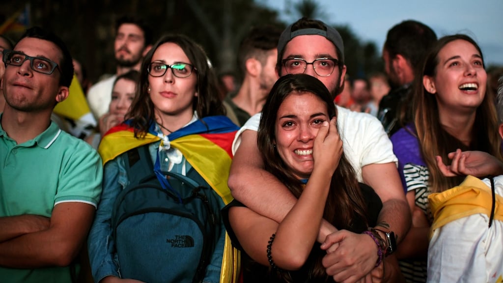 Pro-independence supporters watch on broadcast screens outside the Catalan parliament as regional president Carles Puigdemont outlines his government’s response to the referendum result of October 10th. Photograph: Jeff J Mitchell/Getty Images