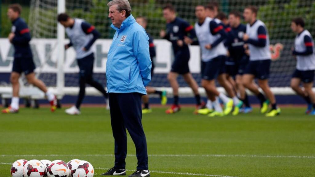 England’s manager Roy Hodgson watches a training session ahead of their World Cup qualifyier against Poland.