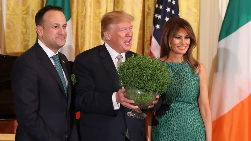 Taoiseach Leo Varadkar presents US president Donald Trump with a bowl of shamrock as Melania Trump looks on during the annual presentation ceremony at the White House in Washington, DC n 2018. Photograph: Niall Carson/PA Wire
