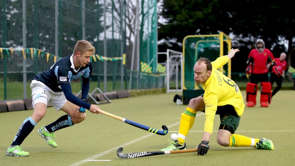Lisnagarvey’s Neal Glassey with Kenny Carroll of Railway Union in Senior Cup action. Photograph: INPHO/Dan Sheridan