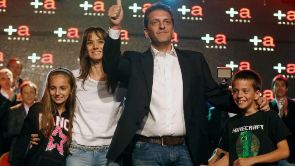 Sergio Massa, mayor of Buenos Aires’s Tigre, with his wife Malena and children Milagros and Tomas, after the resuts in the Argentinian midterm election. Photograph: Enrique Marcarian/Reuters