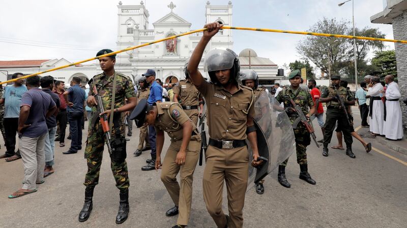 Sri Lankan military officials stand guard in front of the St Anthony’s Shrine, Kochchikade church after an explosion in Colombo, Sri Lanka. Photograph: Dinuka Liyanawatte/Reuters