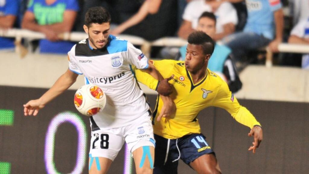 Apollon Limassol’s Marios Stylianou (left) is challenged by Lazio’s Keita Balde in Nicosia. Photograph: Andreas Manolis/Reuters
