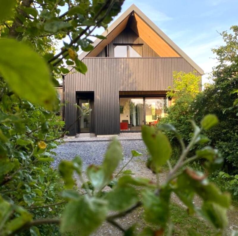 A view of the Swiss chalet-style covered balcony off the principal bedroom