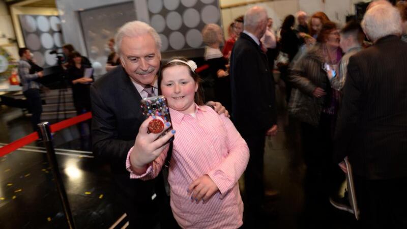 Winning Streak: Marty Whelan with 11-year-old Emma Quigley. Photograph: Bryan Meade