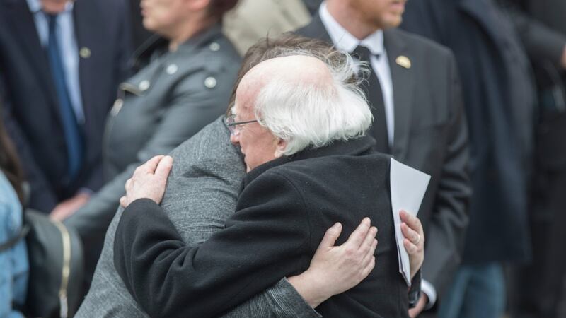 President Michael D Higgins offers his condolences to Lyra McKee’s partner Sarah Canning after the funeral service in Belfast. Photograph: EPA