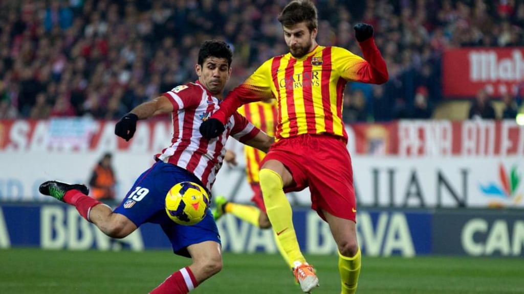 Atlético Madrid striker Diego Costa doesn’t hold back against Barcelona defender Gerard Pique. Photograph: Gonzalo Arroyo Moreno/Getty Images