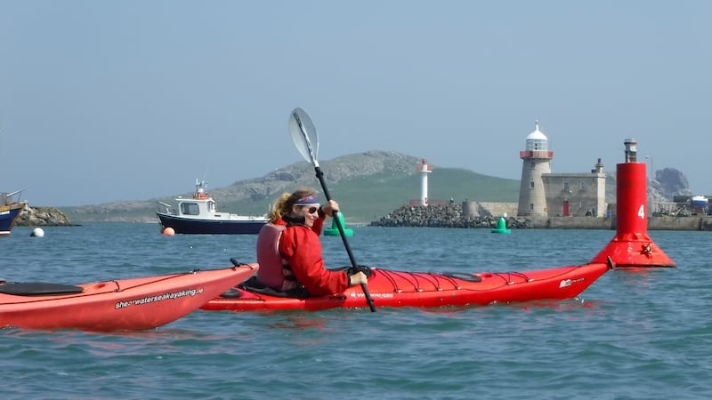 Kayaking with Howth harbour in the background.