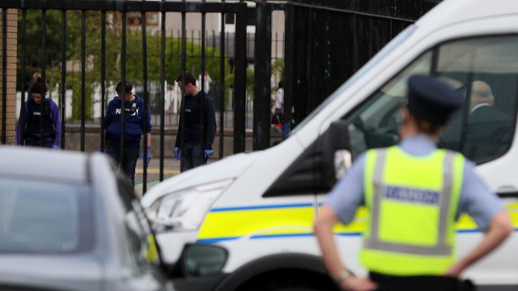 Gardaí at the scene in the Marigold Road area of Darndale after a second man was shot in Dublin in less than 24 hours. Photograph: Brian Lawless/PA Wire