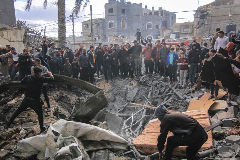 Palestinians search the rubble of buildings destroyed by an Israeli airstrike in Khan Younis, southern Gaza, on January 12th. Photograph: Ahmad Salem/Bloomberg